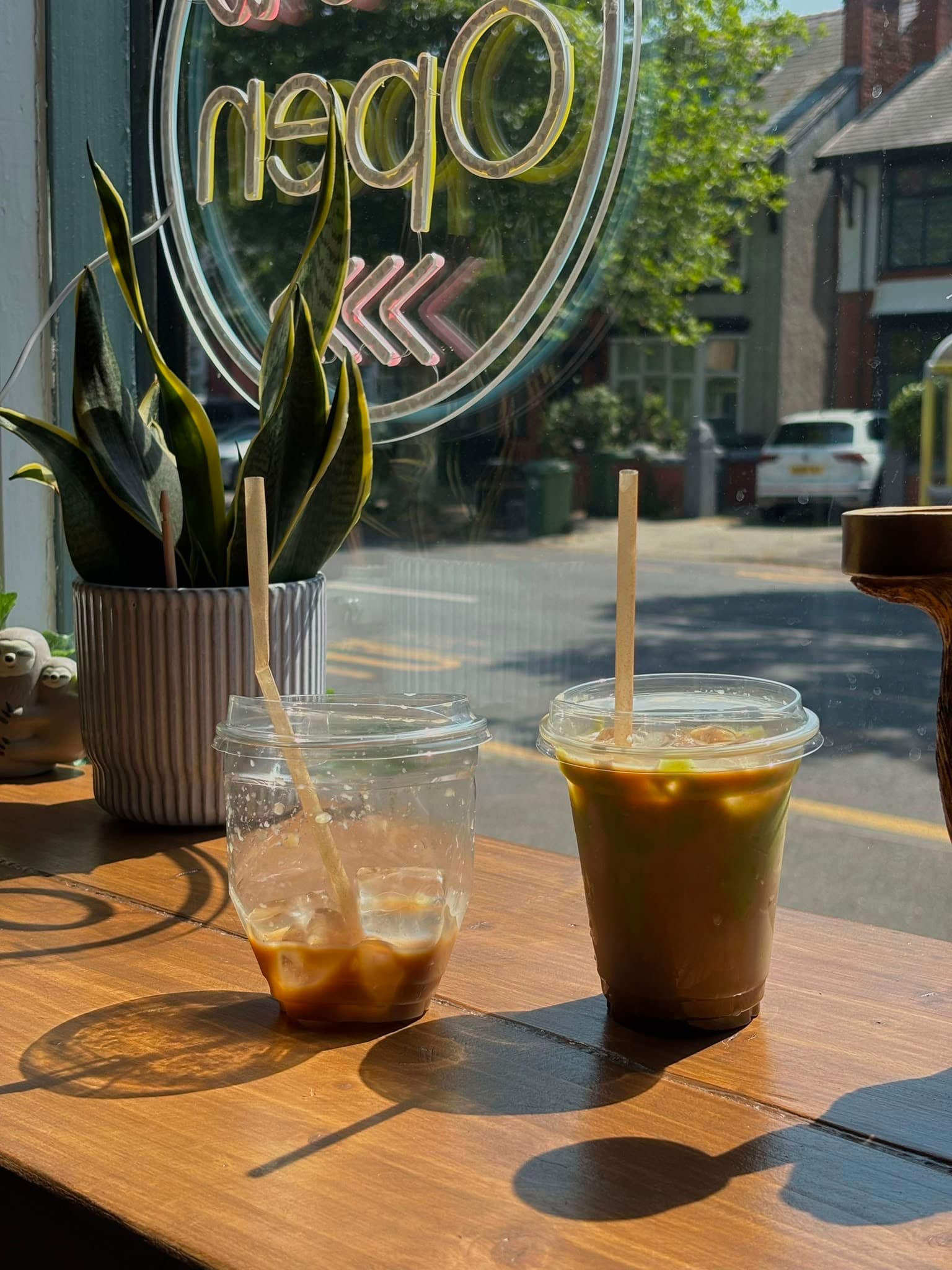 Two iced coffees in the cafe window